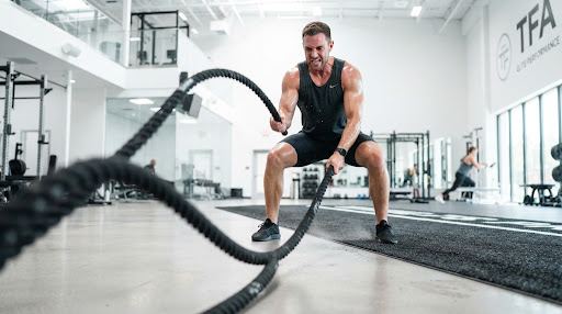 Athlete using battle ropes